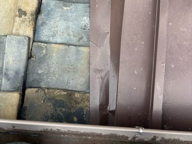 志免町の凹んだ金属屋根