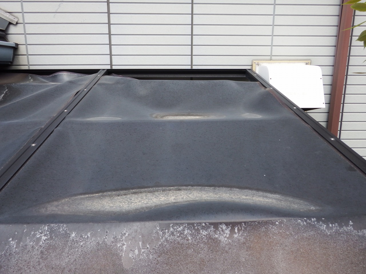 生駒市の歪んだテラス屋根の無料点検